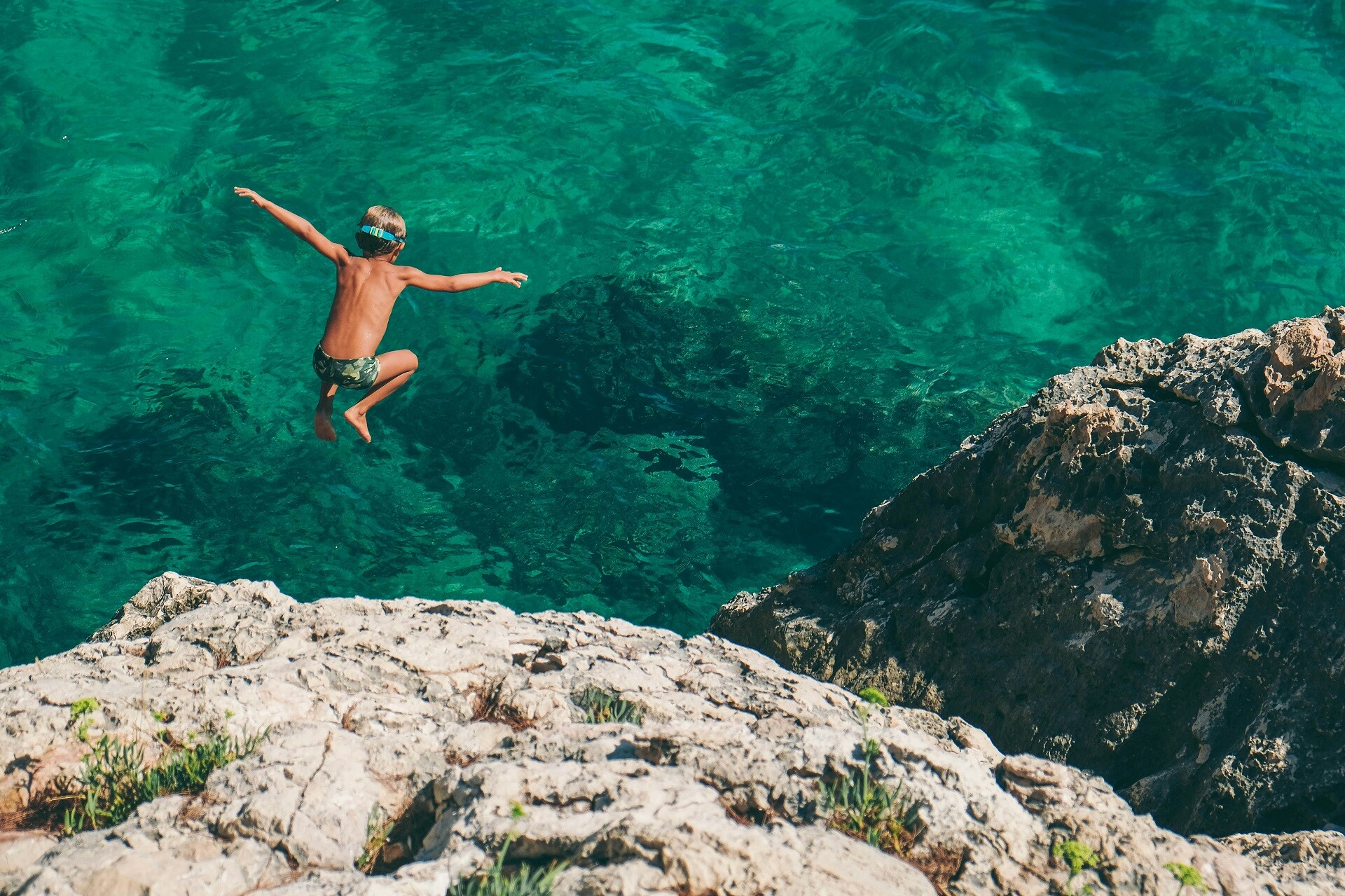 A sailor jumps into the crystal-clear Adriatic Sea near Hvar Island—an unforgettable moment of freedom and refreshment.